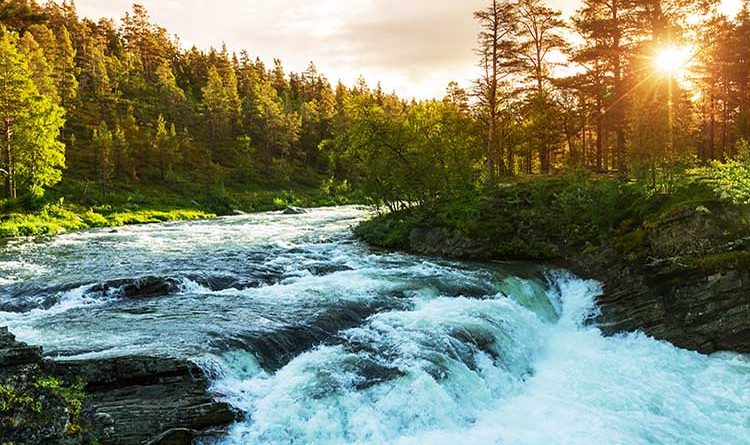 Scenic river in Norway with small waterfall