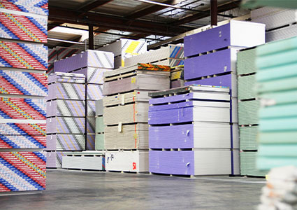 Pallets of gypsum board in a warehouse