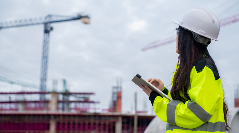 Image of a female construction worker in uniform stood on a work site to support CHIPS article