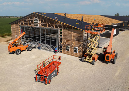 cherry picker & lift tractors building a framed construction