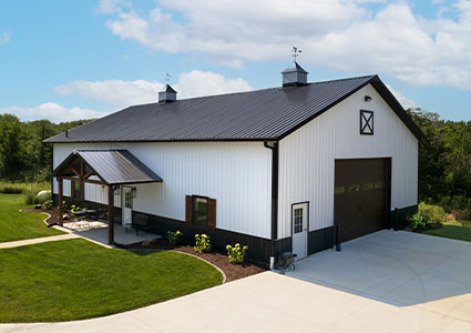 White single story building with black roof